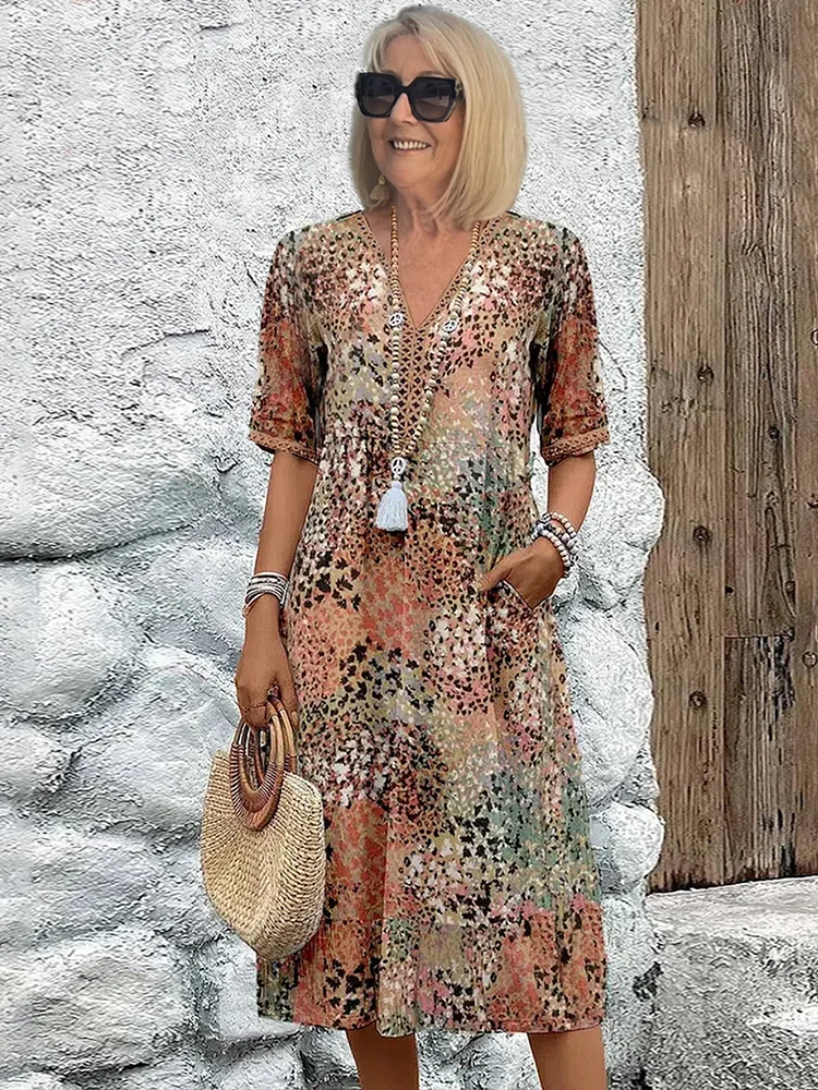 SUSAN | ROBE MIDI VIBRANTE AVEC UNE ÉLÉGANTE COUVERTURE DU VENTRE