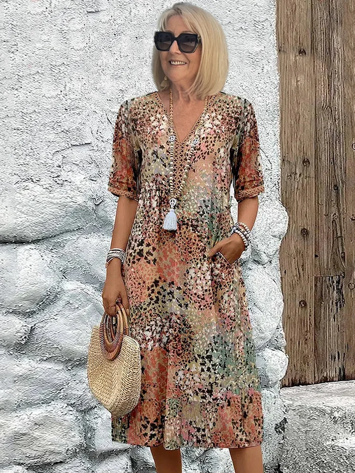 SUSAN | ROBE MIDI VIBRANTE AVEC UNE ÉLÉGANTE COUVERTURE DU VENTRE