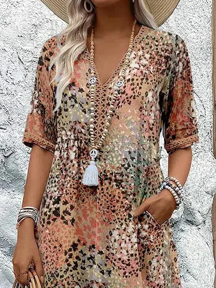 SUSAN | ROBE MIDI VIBRANTE AVEC UNE ÉLÉGANTE COUVERTURE DU VENTRE