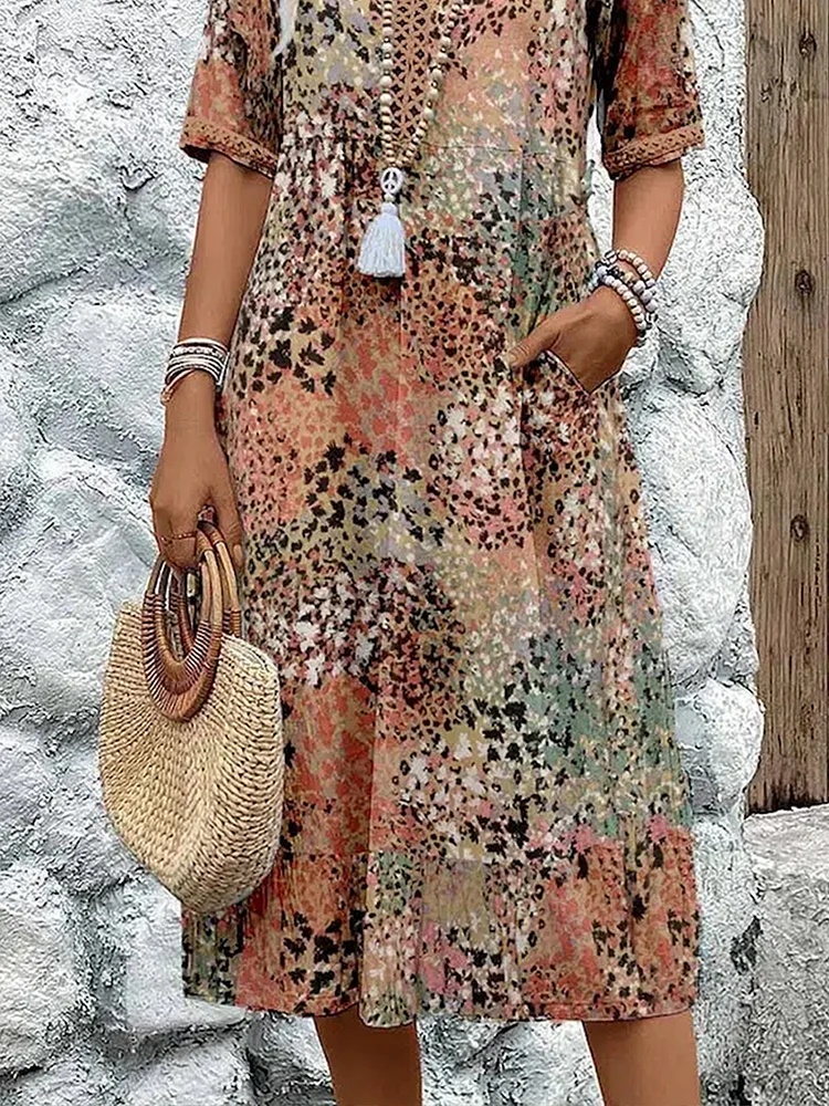 SUSAN | ROBE MIDI VIBRANTE AVEC UNE ÉLÉGANTE COUVERTURE DU VENTRE