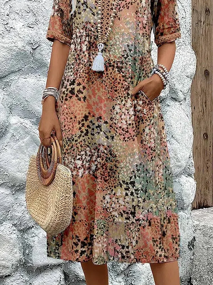 SUSAN | ROBE MIDI VIBRANTE AVEC UNE ÉLÉGANTE COUVERTURE DU VENTRE
