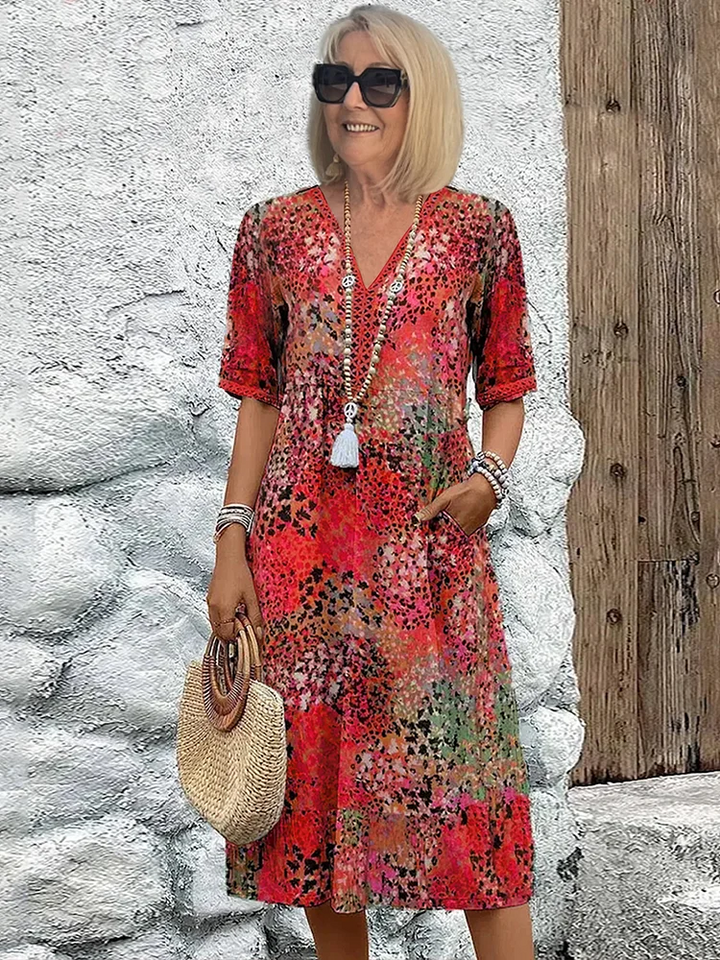 SUSAN | ROBE MIDI VIBRANTE AVEC UNE ÉLÉGANTE COUVERTURE DU VENTRE