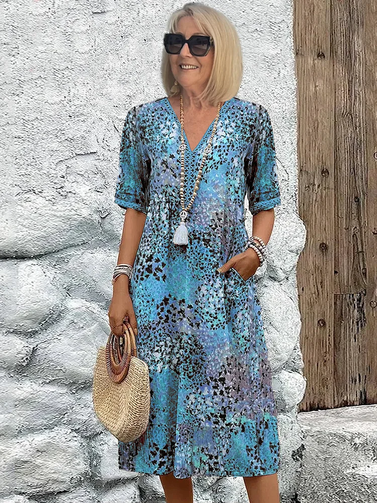 SUSAN | ROBE MIDI VIBRANTE AVEC UNE ÉLÉGANTE COUVERTURE DU VENTRE
