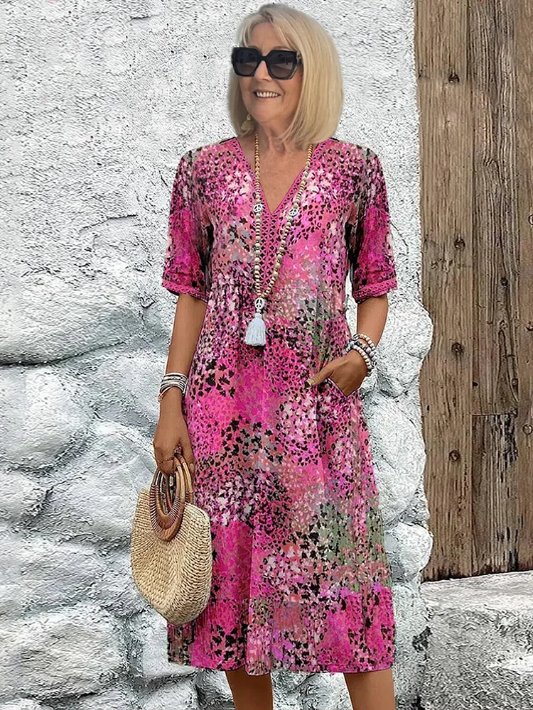 SUSAN | ROBE MIDI VIBRANTE AVEC UNE ÉLÉGANTE COUVERTURE DU VENTRE