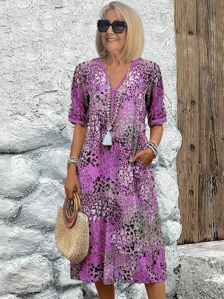 SUSAN | ROBE MIDI VIBRANTE AVEC UNE ÉLÉGANTE COUVERTURE DU VENTRE