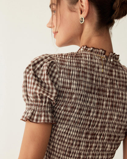 Mini-robe à carreaux café à manches bouffantes
